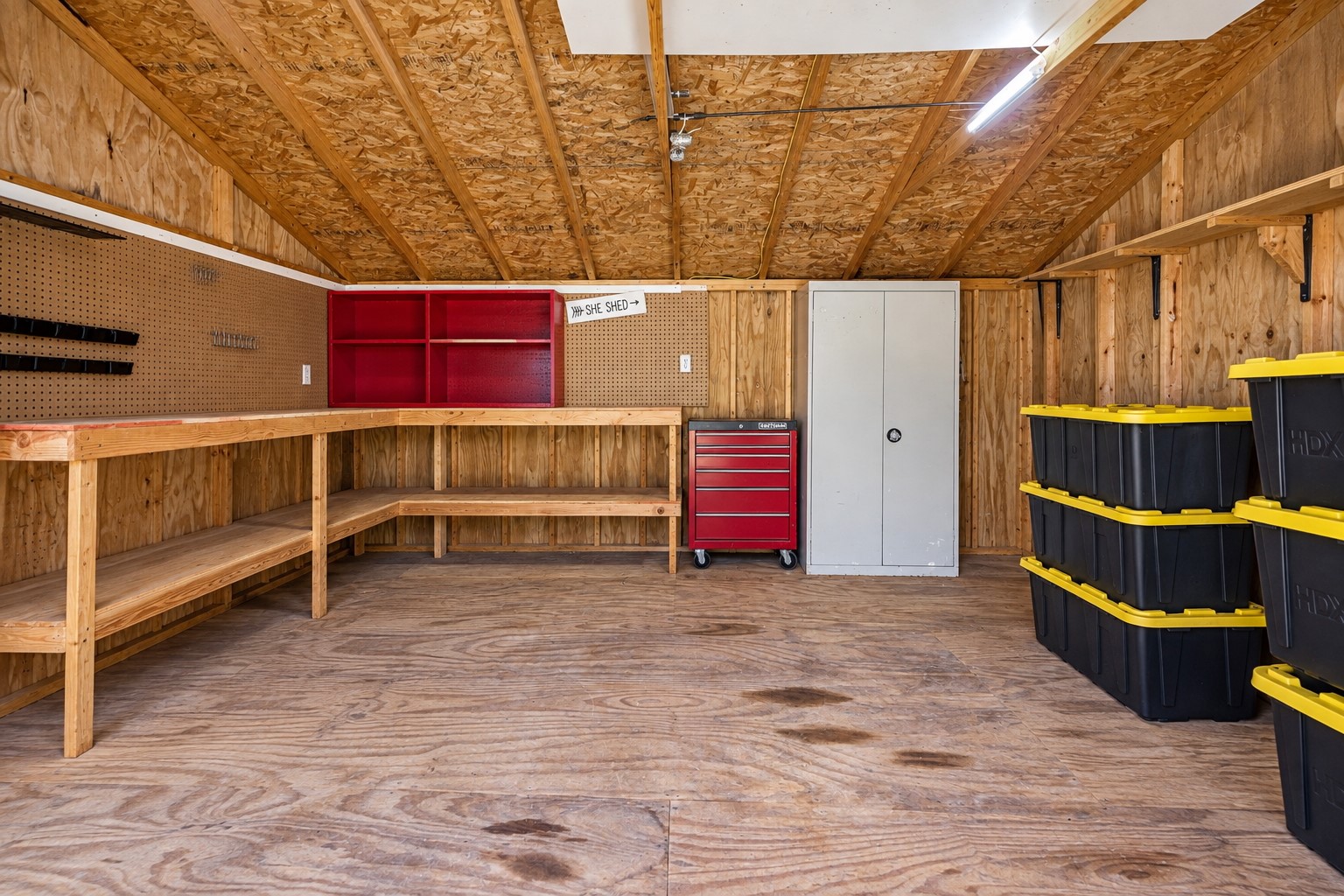 22698 Brook Forest Road New Caney, TX 77357 - Photo 40 of 46 Spacious outbuilding with built-in shelving and plenty of room for tools & equipment!