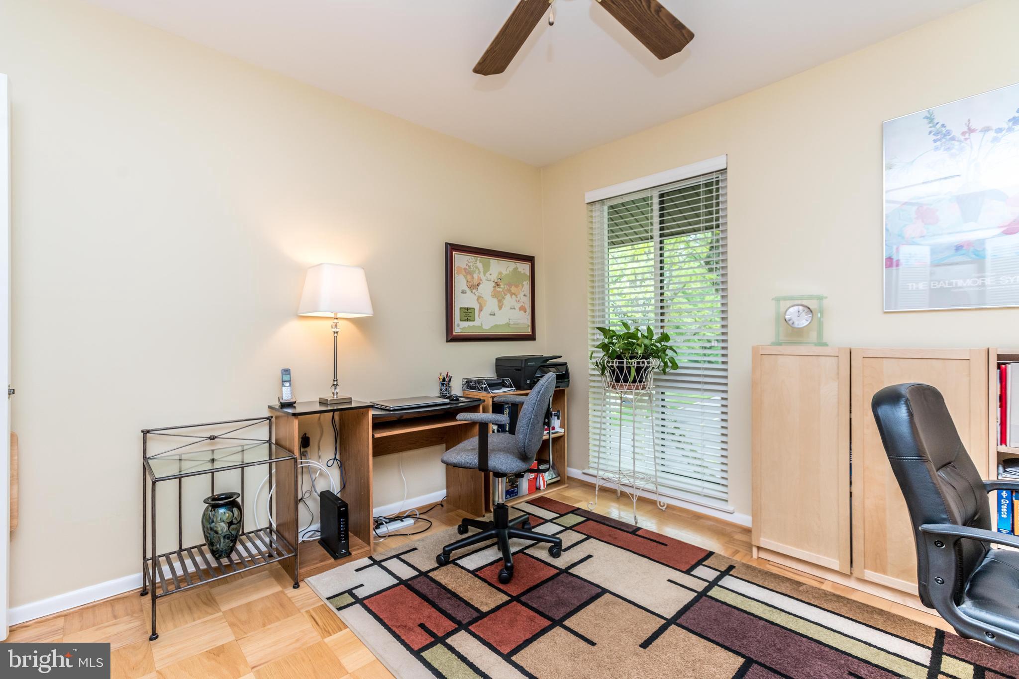 112 Cross Keys Road, Unit R112F Baltimore, MD 21210 - Photo 21 of 30 the room features large windows and ceiling fan.