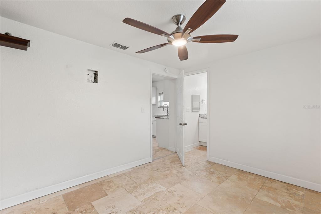 2462 Fort Lane Road Geneva, FL 32732 - Photo 17 of 31 an empty room with closet and fan