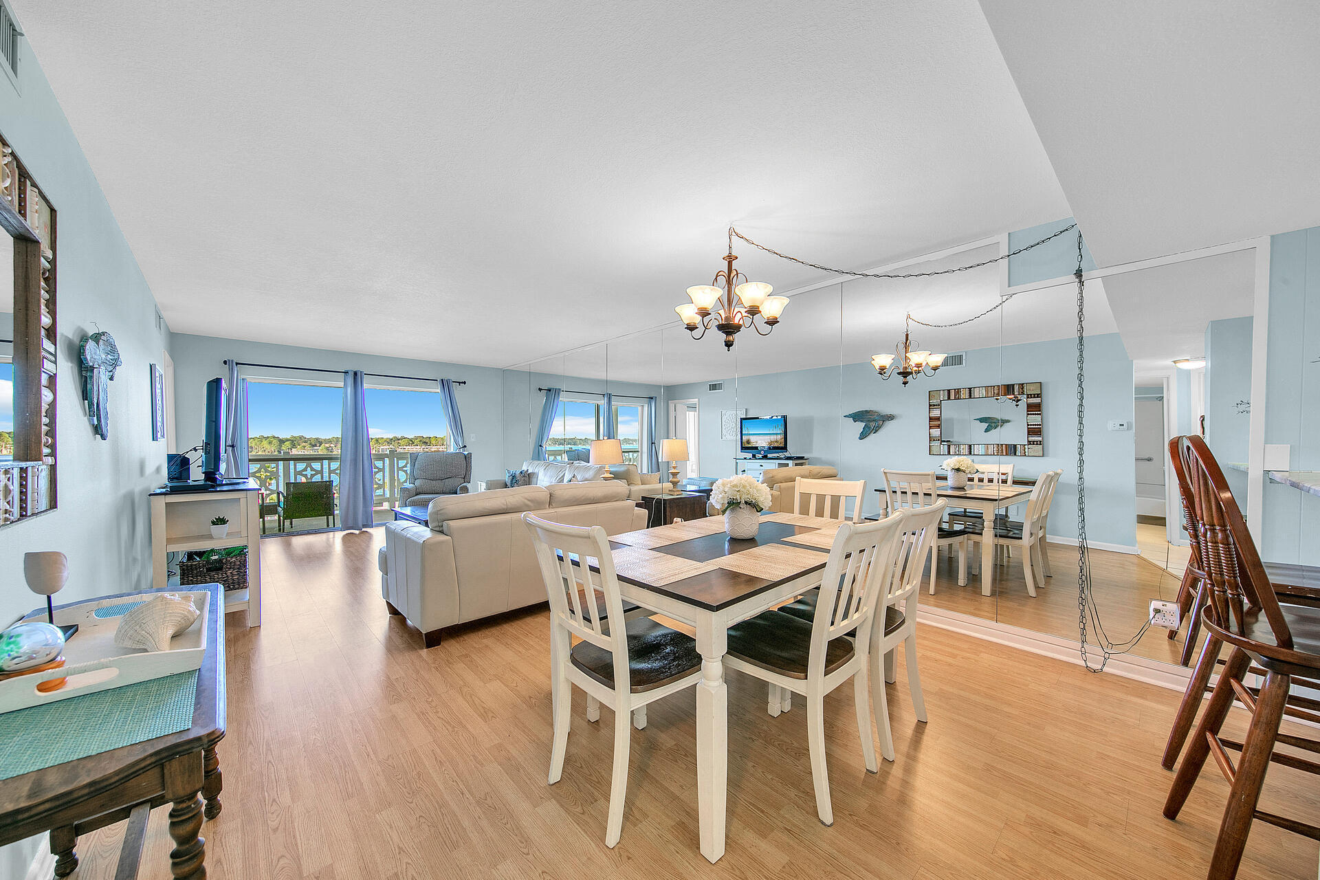 909 Santa Rosa Boulevard, Unit 561 Fort Walton Beach, FL 32548 - Photo 14 of 61 a view of a dining room with furniture window and wooden floor