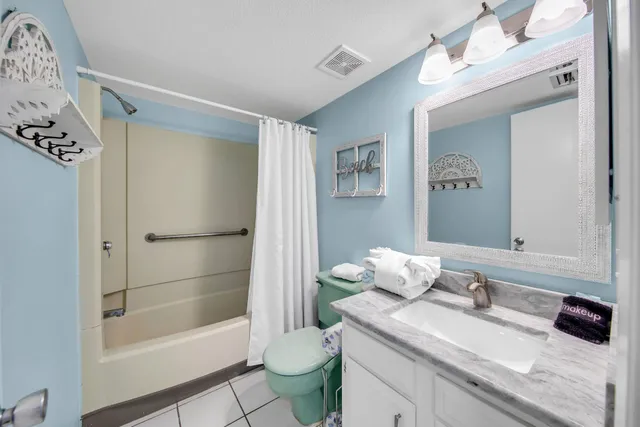a bathroom with a bathtub sink and toilet