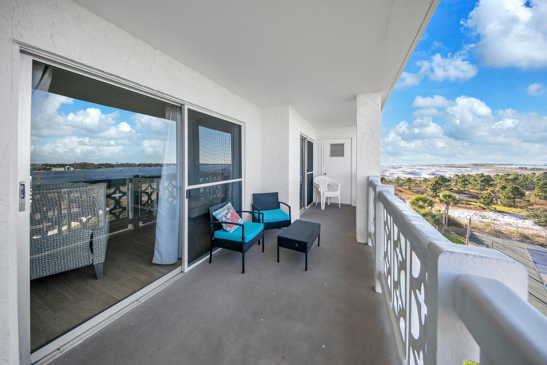 909 Santa Rosa Boulevard, Unit 561 Fort Walton Beach, FL 32548 - Photo 25 of 61 a living room with furniture a rug and a large window