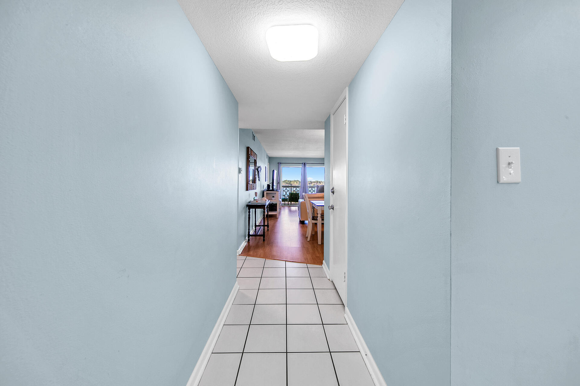 909 Santa Rosa Boulevard, Unit 561 Fort Walton Beach, FL 32548 - Photo 28 of 61 a view of a hallway to a livingroom with a fireplace