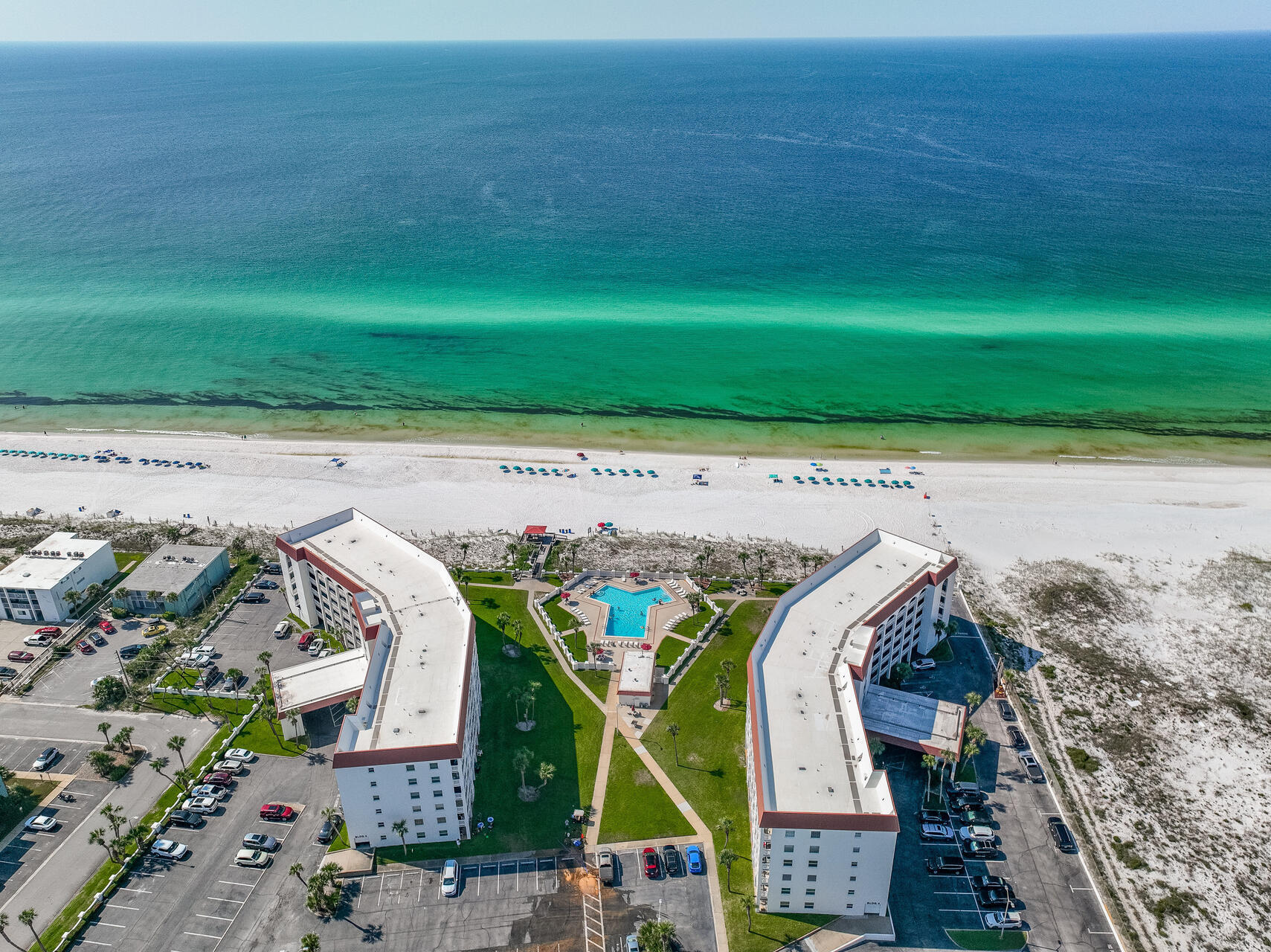 909 Santa Rosa Boulevard, Unit 561 Fort Walton Beach, FL 32548 - Photo 55 of 61 a view of swimming pool with a table and chairs in the patio