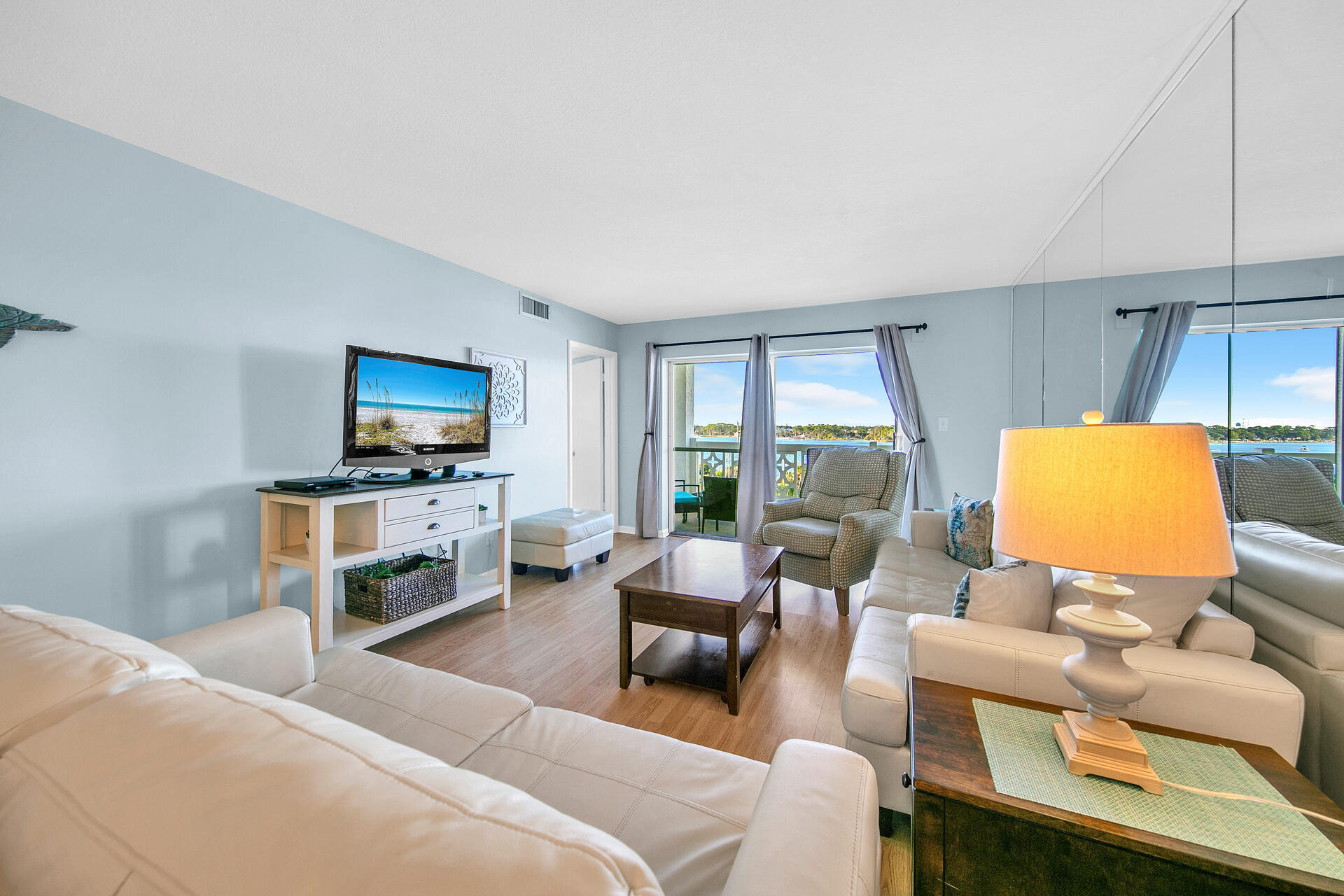 909 Santa Rosa Boulevard, Unit 561 Fort Walton Beach, FL 32548 - Photo 8 of 61 a living room with furniture and a flat screen tv