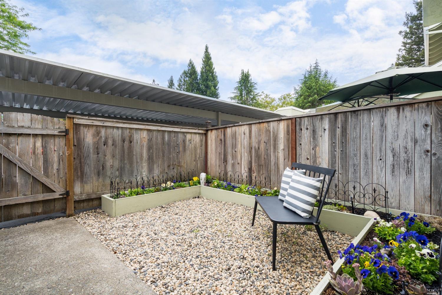 580 Racquet Club Circle Rohnert Park, CA 94928 - Photo 1 of 1 a backyard of a house with table and chairs