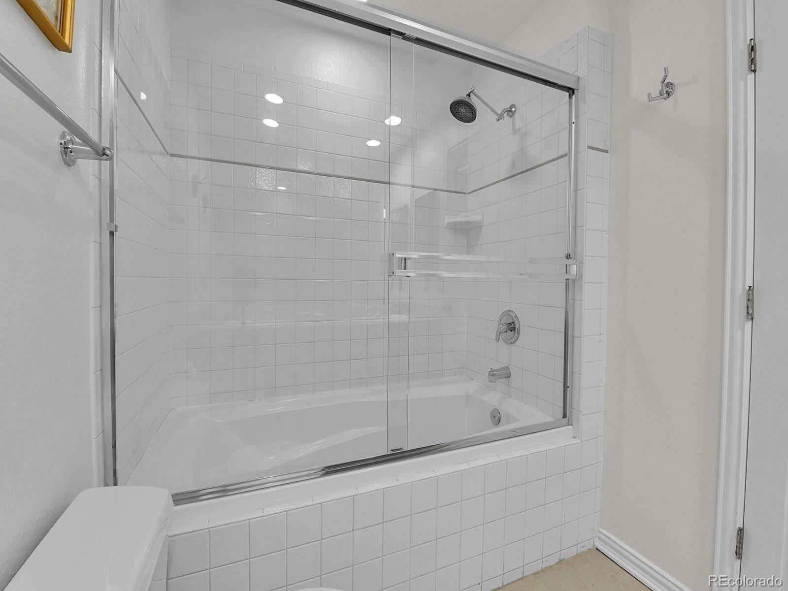 45 Jackson Street, Unit D Denver, CO 80206 - Photo 17 of 29 a bathroom with a shower and a toilet