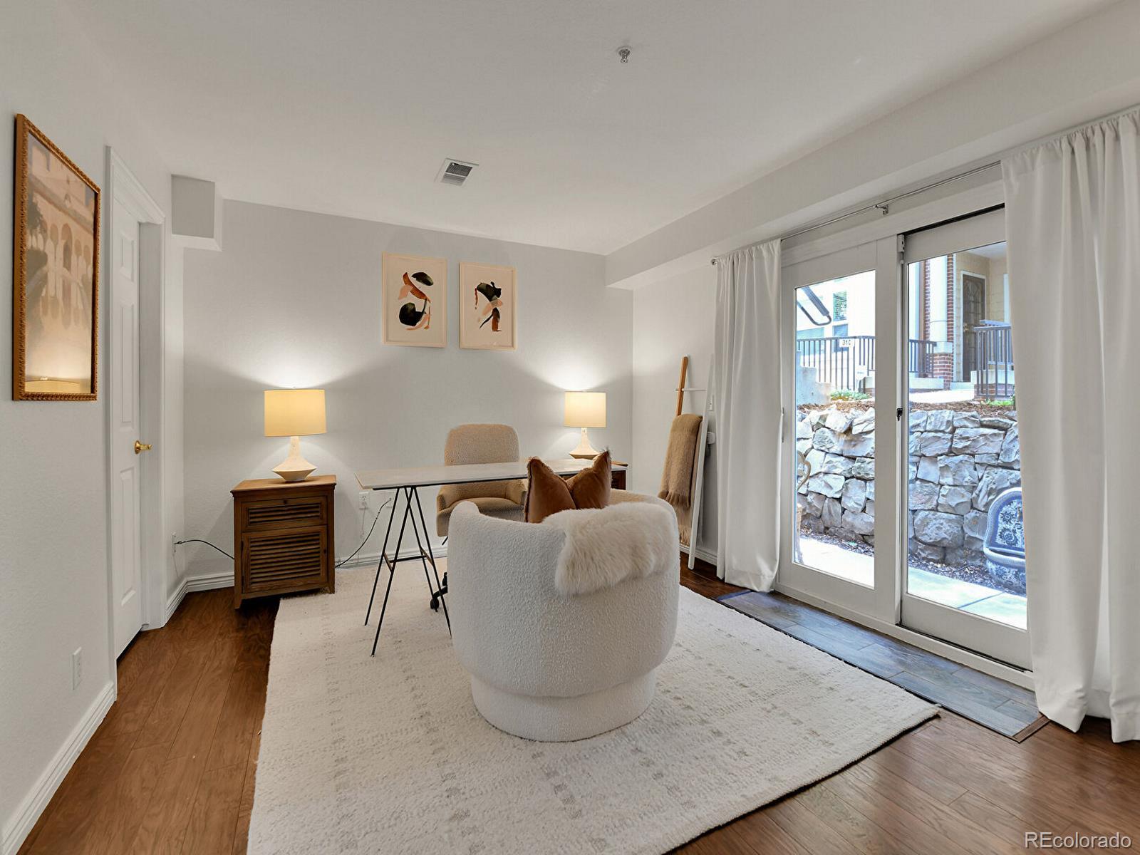 45 Jackson Street, Unit D Denver, CO 80206 - Photo 18 of 29 a living room with furniture and a window