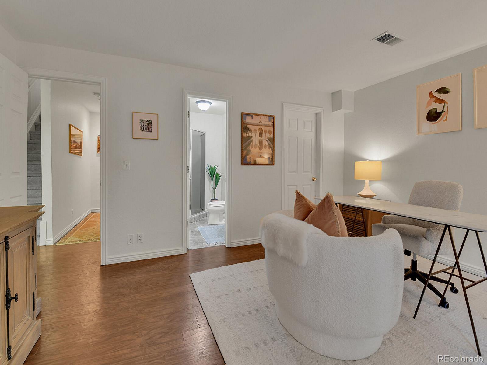 45 Jackson Street, Unit D Denver, CO 80206 - Photo 19 of 29 a living room with furniture and a table