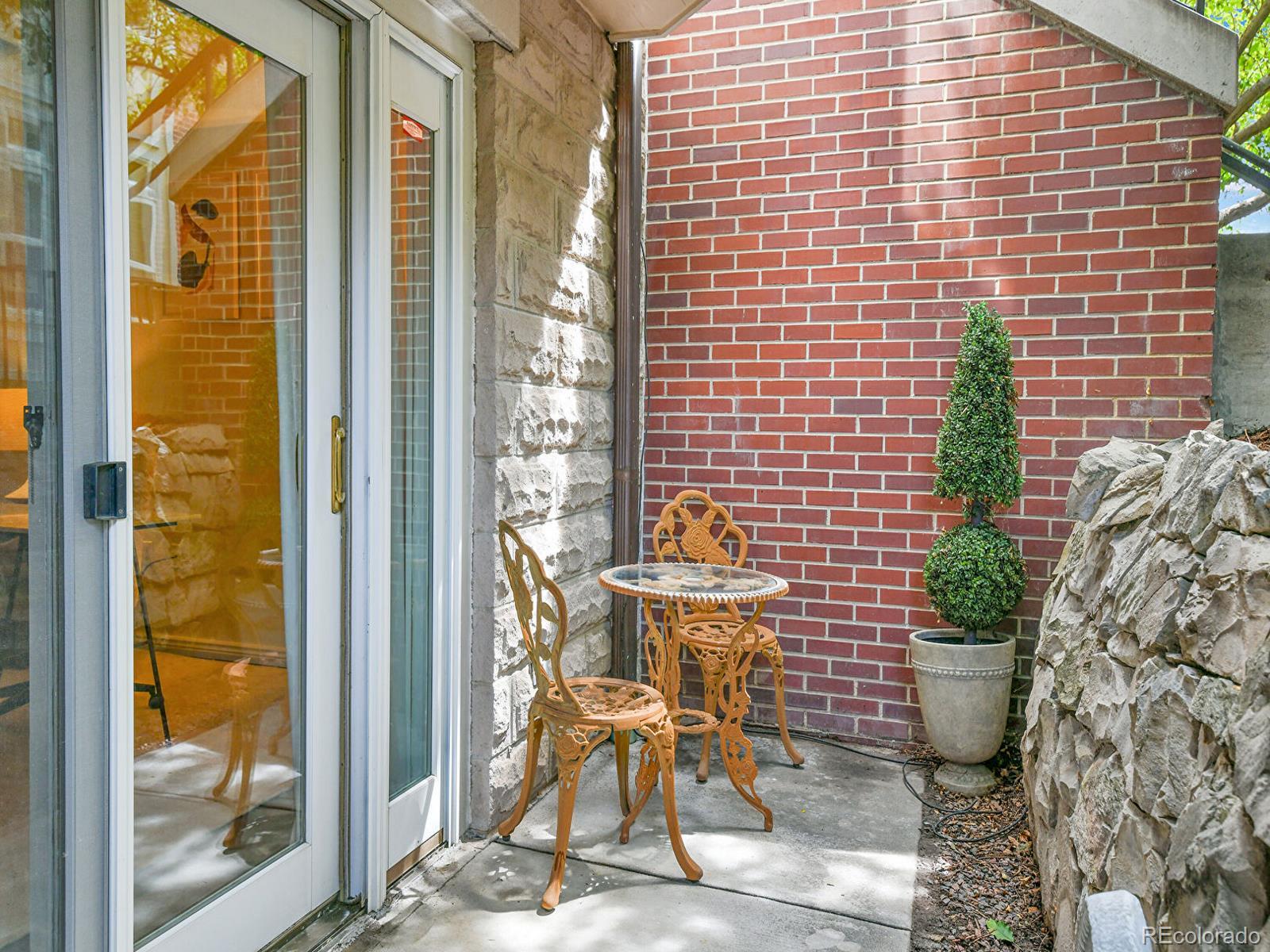 45 Jackson Street, Unit D Denver, CO 80206 - Photo 23 of 29 a view of chair with a potted plant