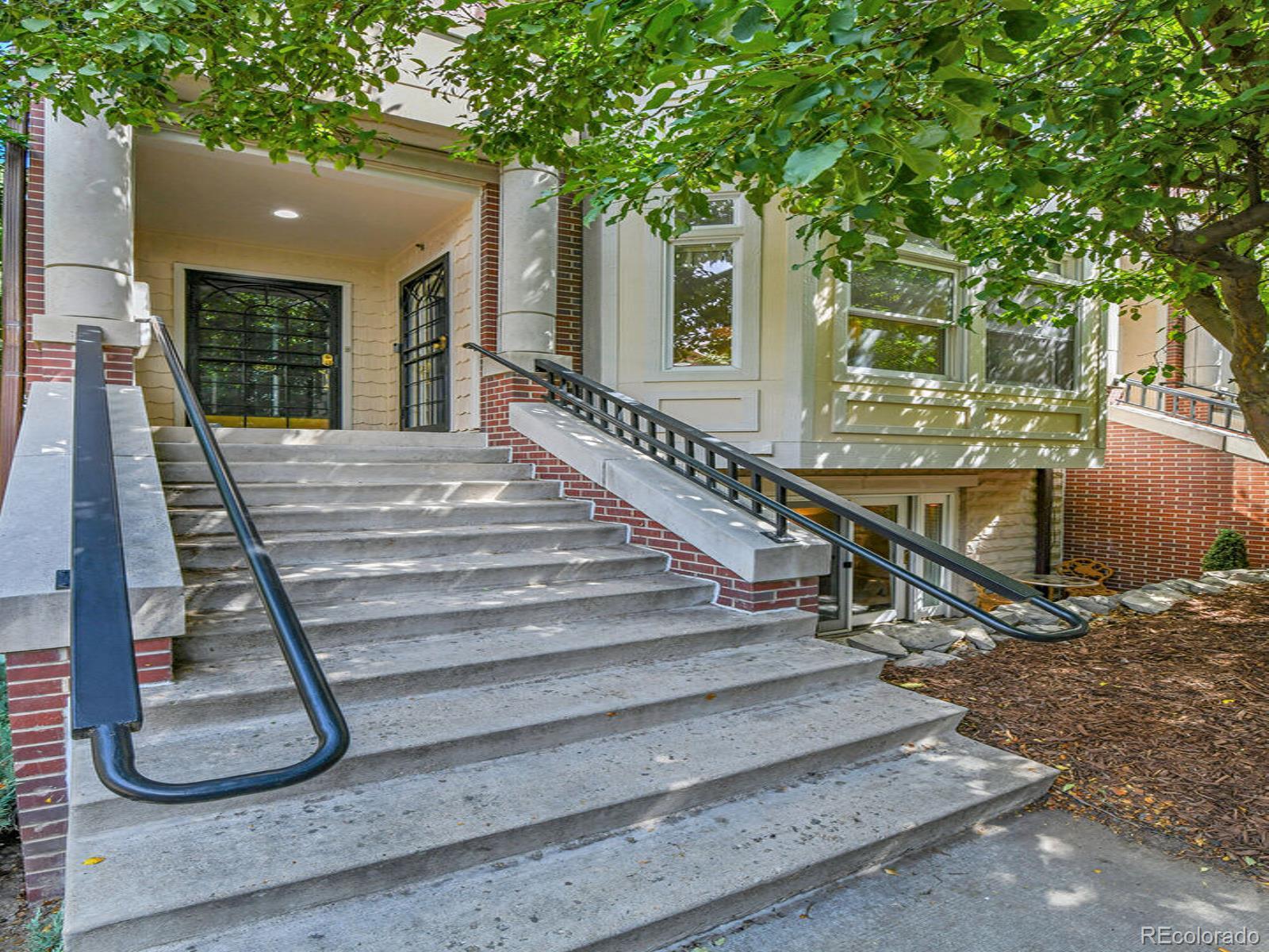 45 Jackson Street, Unit D Denver, CO 80206 - Photo 4 of 29 a view of entryway with wooden floor and a yard