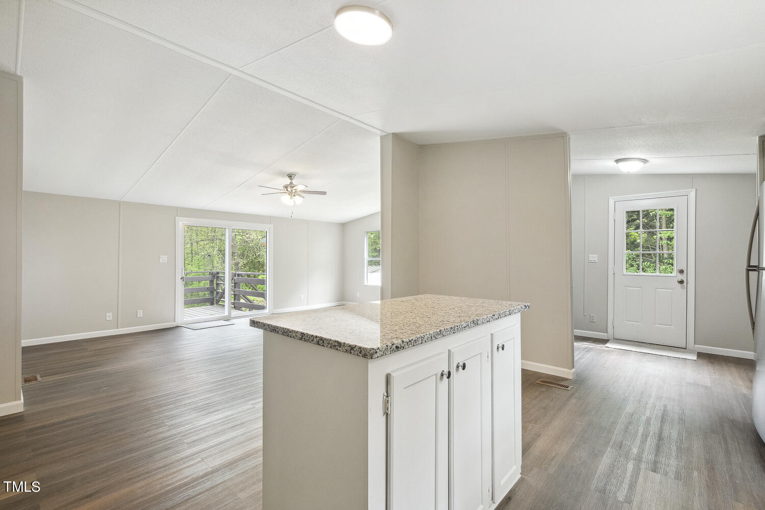 3820 Morton-Pulliam Road Roxboro, NC 27574 - Photo 13 of 37 an empty room with wooden floor and windows