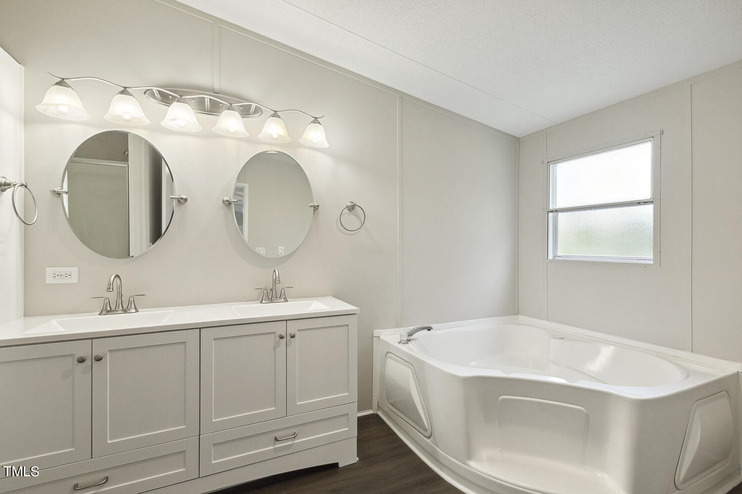3820 Morton-Pulliam Road Roxboro, NC 27574 - Photo 24 of 37 a bathroom with a sink and a mirror