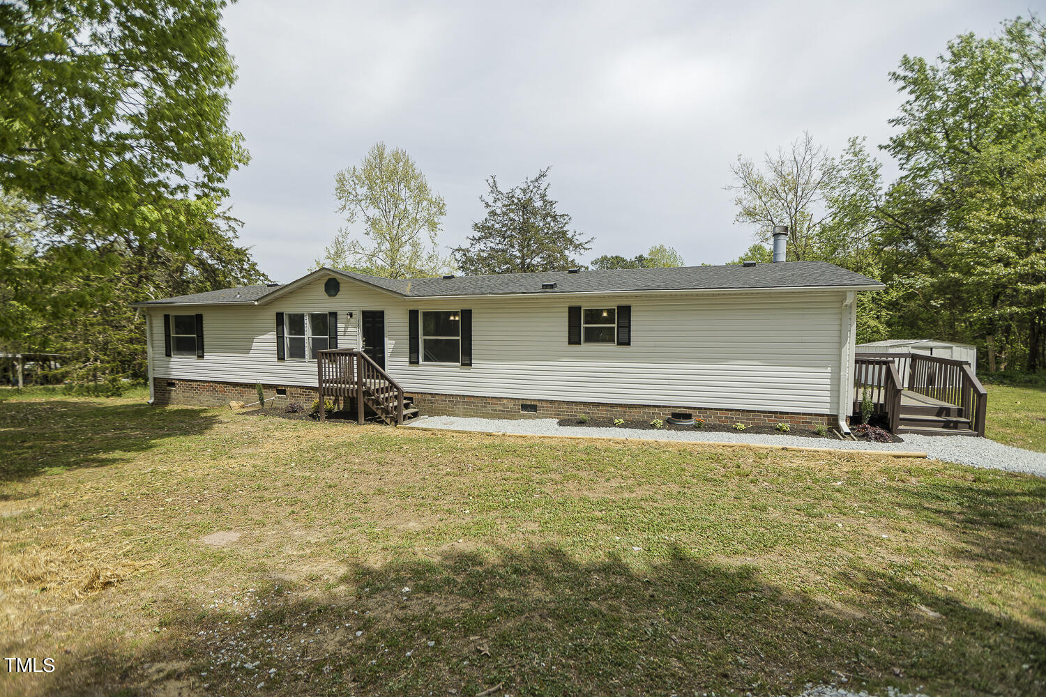 3820 Morton-Pulliam Road Roxboro, NC 27574 - Photo 3 of 37 a house view with a garden space
