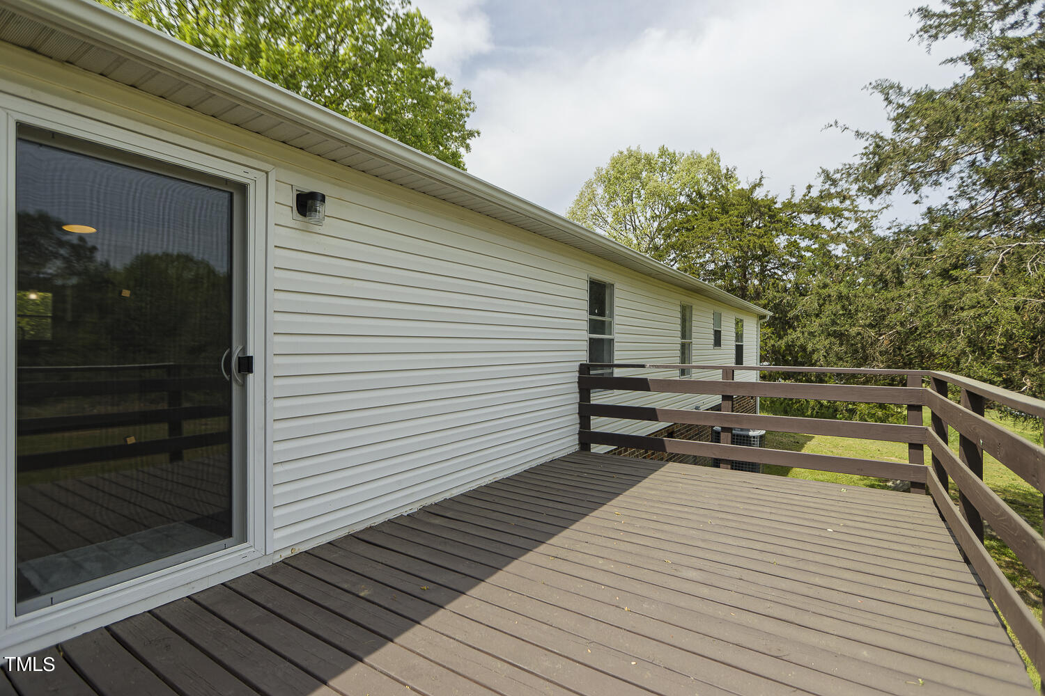 3820 Morton-Pulliam Road Roxboro, NC 27574 - Photo 33 of 37 a balcony with wooden floor and furniture