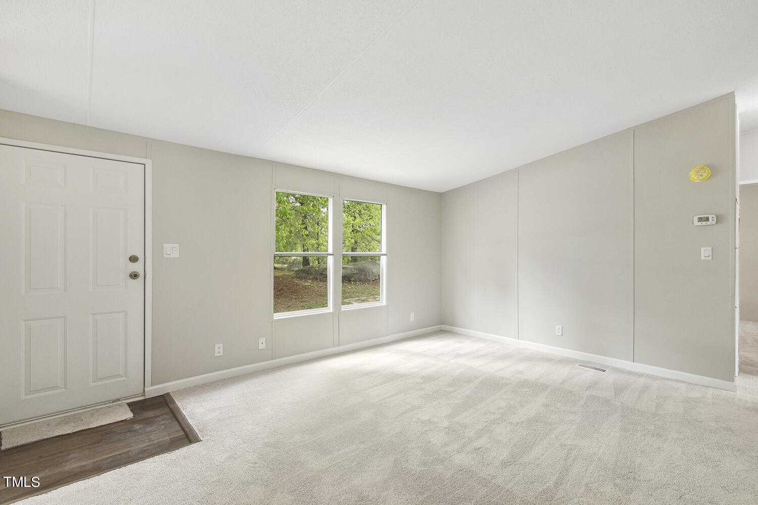 3820 Morton-Pulliam Road Roxboro, NC 27574 - Photo 5 of 37 a view of an empty room with a window