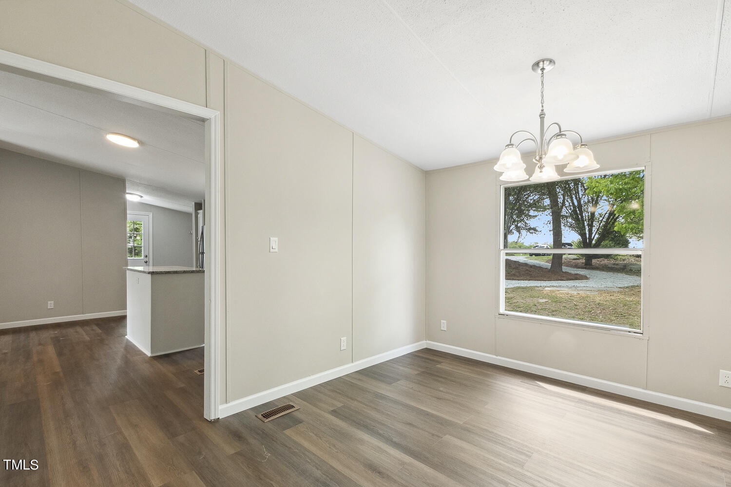 3820 Morton-Pulliam Road Roxboro, NC 27574 - Photo 8 of 37 an empty room with wooden floor and windows