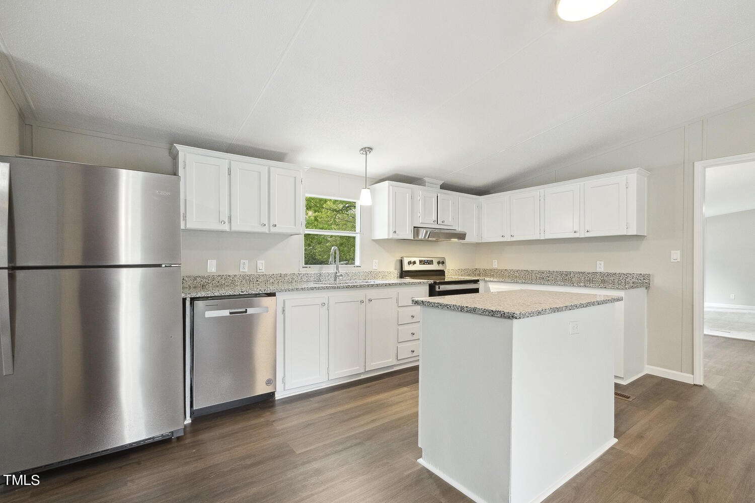 3820 Morton-Pulliam Road Roxboro, NC 27574 - Photo 10 of 37 a kitchen with stainless steel appliances granite countertop a refrigerator a sink dishwasher a stove top oven a refrigerator and white cabinets with wooden floor