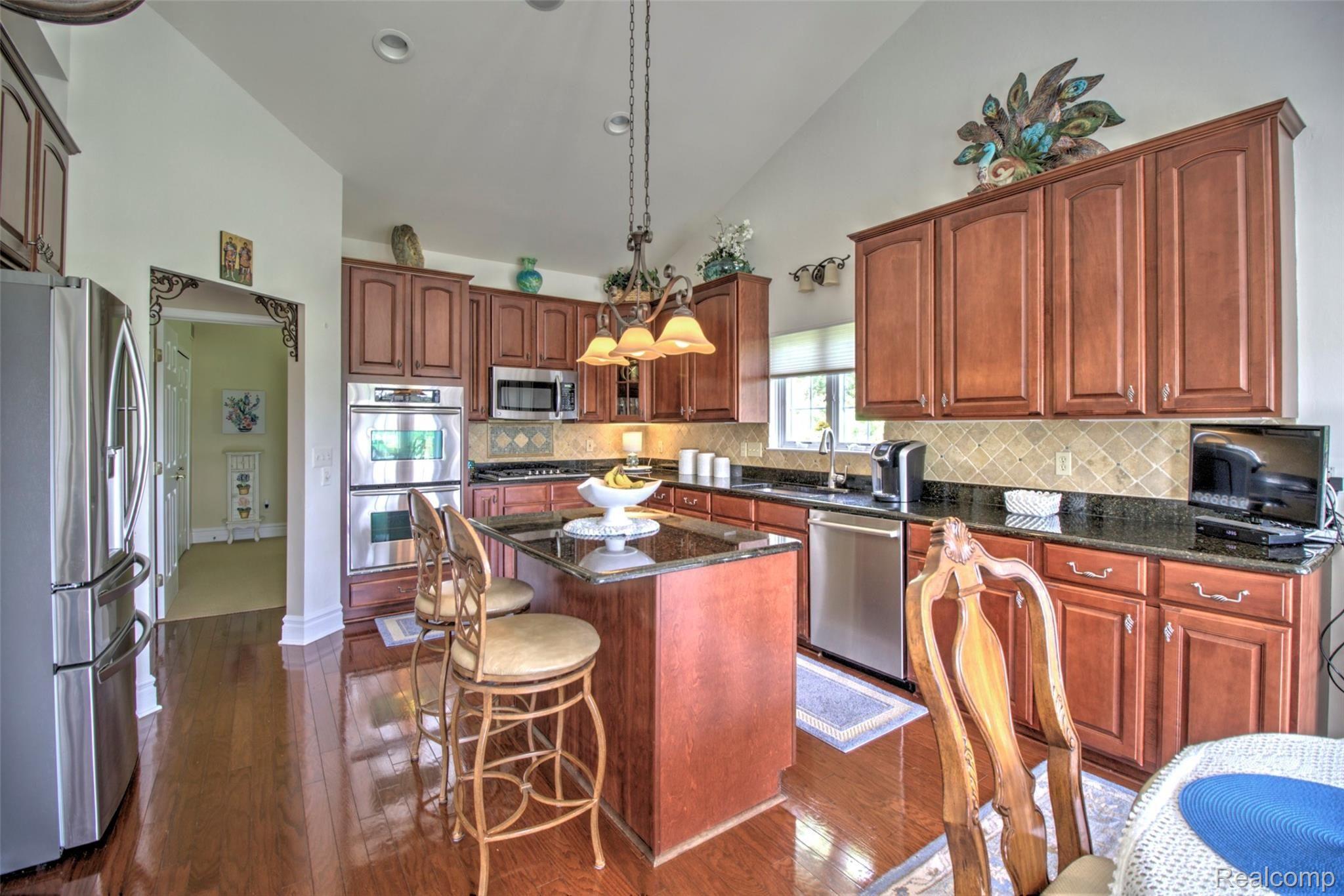 26548 Valhalla Drive, Unit 7 Farmington, MI 48331 - Photo 8 of 30 Gourmet Island Kitchen w/Large Pantry & Top of the Line SS Appliances