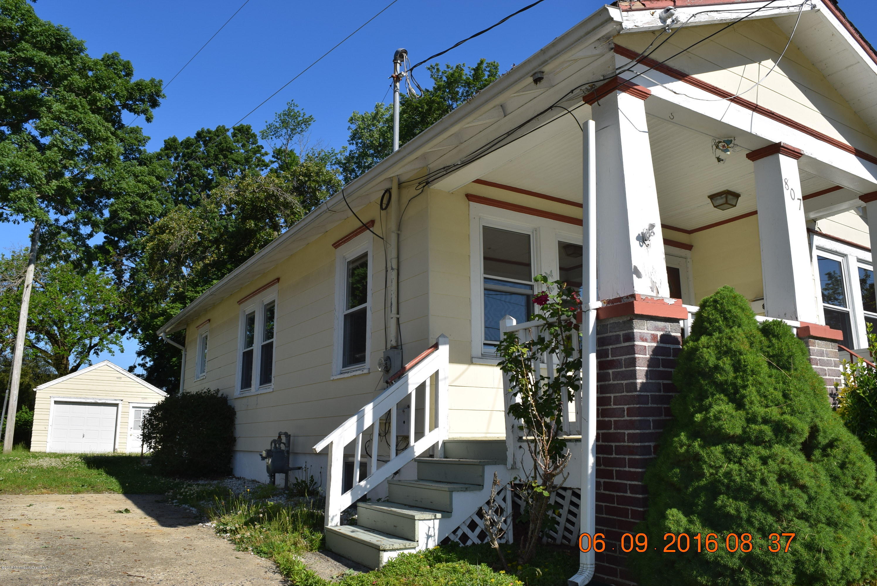 807 Ridge Avenue Neptune City, NJ 07753 - Photo 3 of 15 a aerial view of a house with a yard