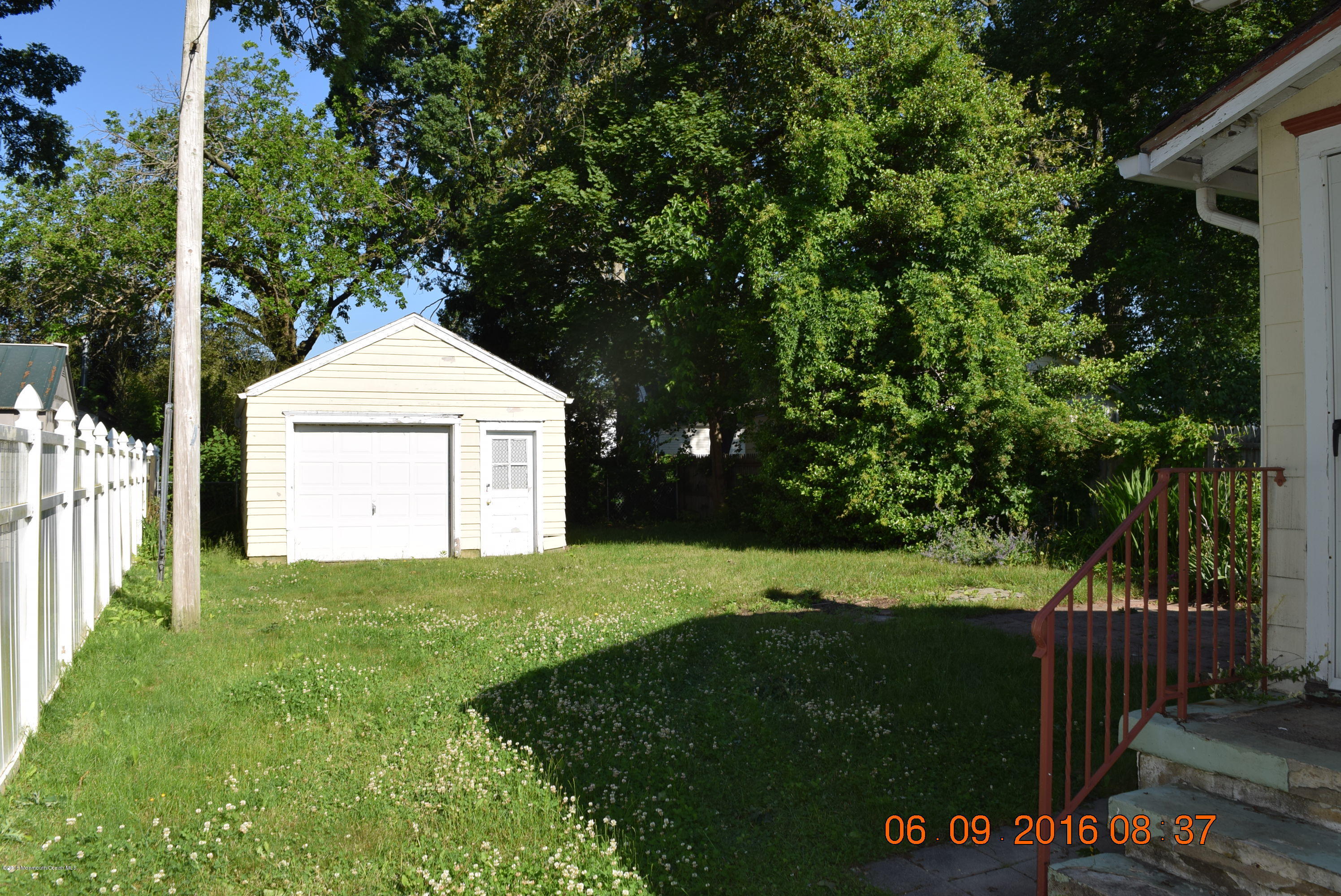 807 Ridge Avenue Neptune City, NJ 07753 - Photo 4 of 15 a front view of a house with a yard