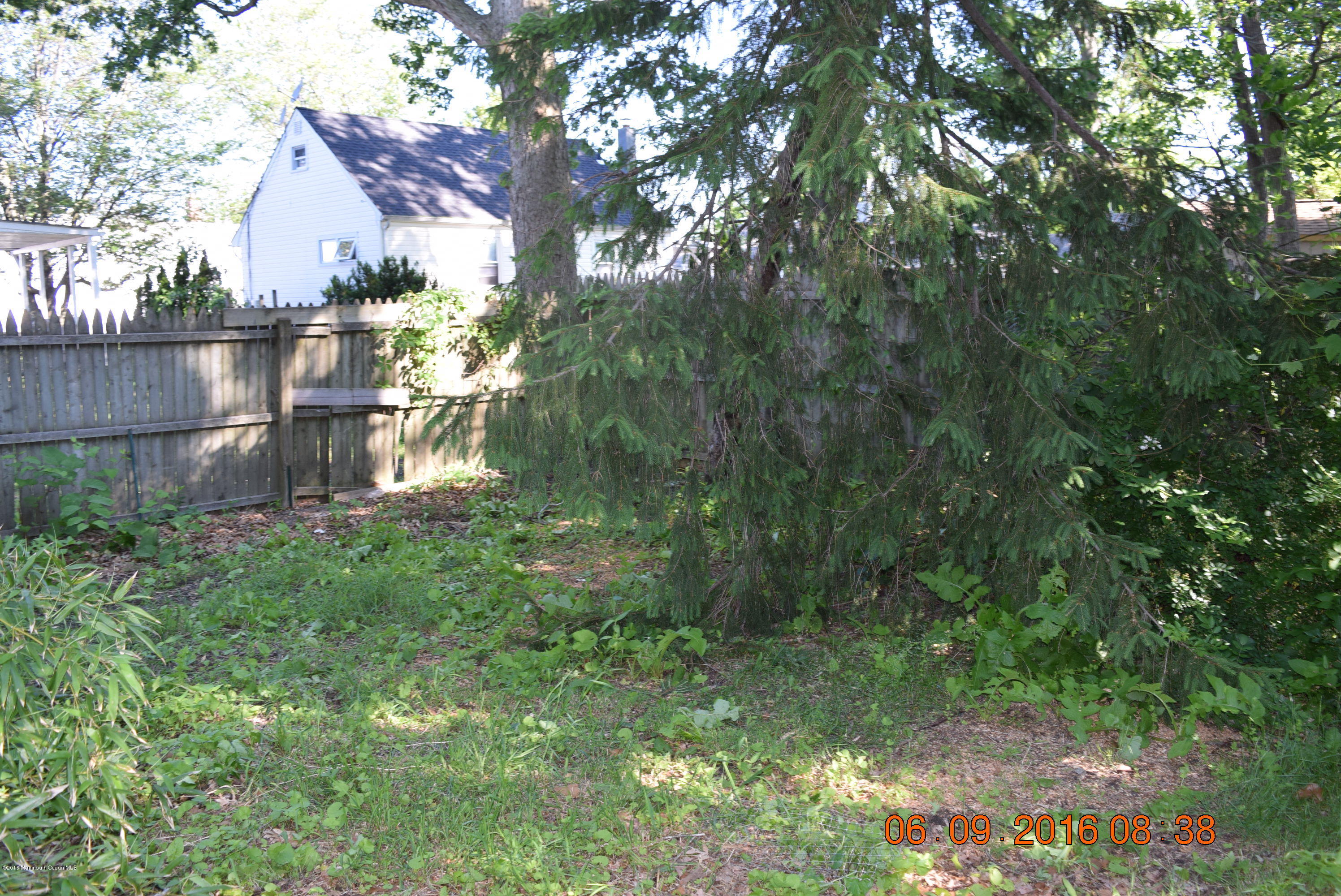 807 Ridge Avenue Neptune City, NJ 07753 - Photo 6 of 15 a backyard of a house with lots of green space