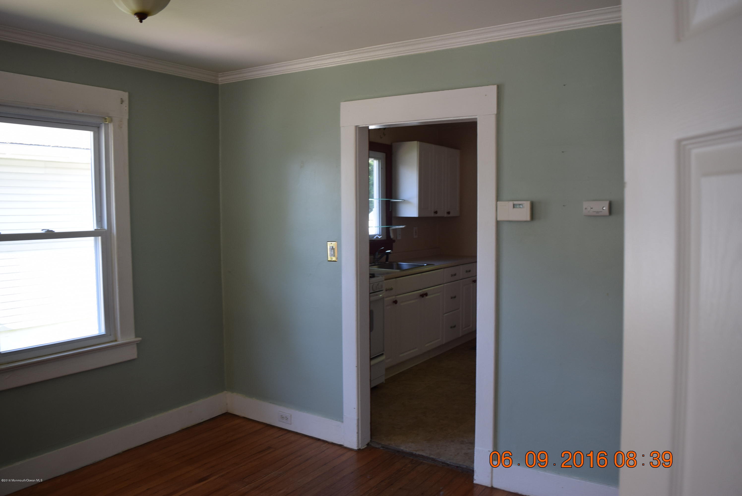 807 Ridge Avenue Neptune City, NJ 07753 - Photo 9 of 15 a view of hallway with wooden floor and closet