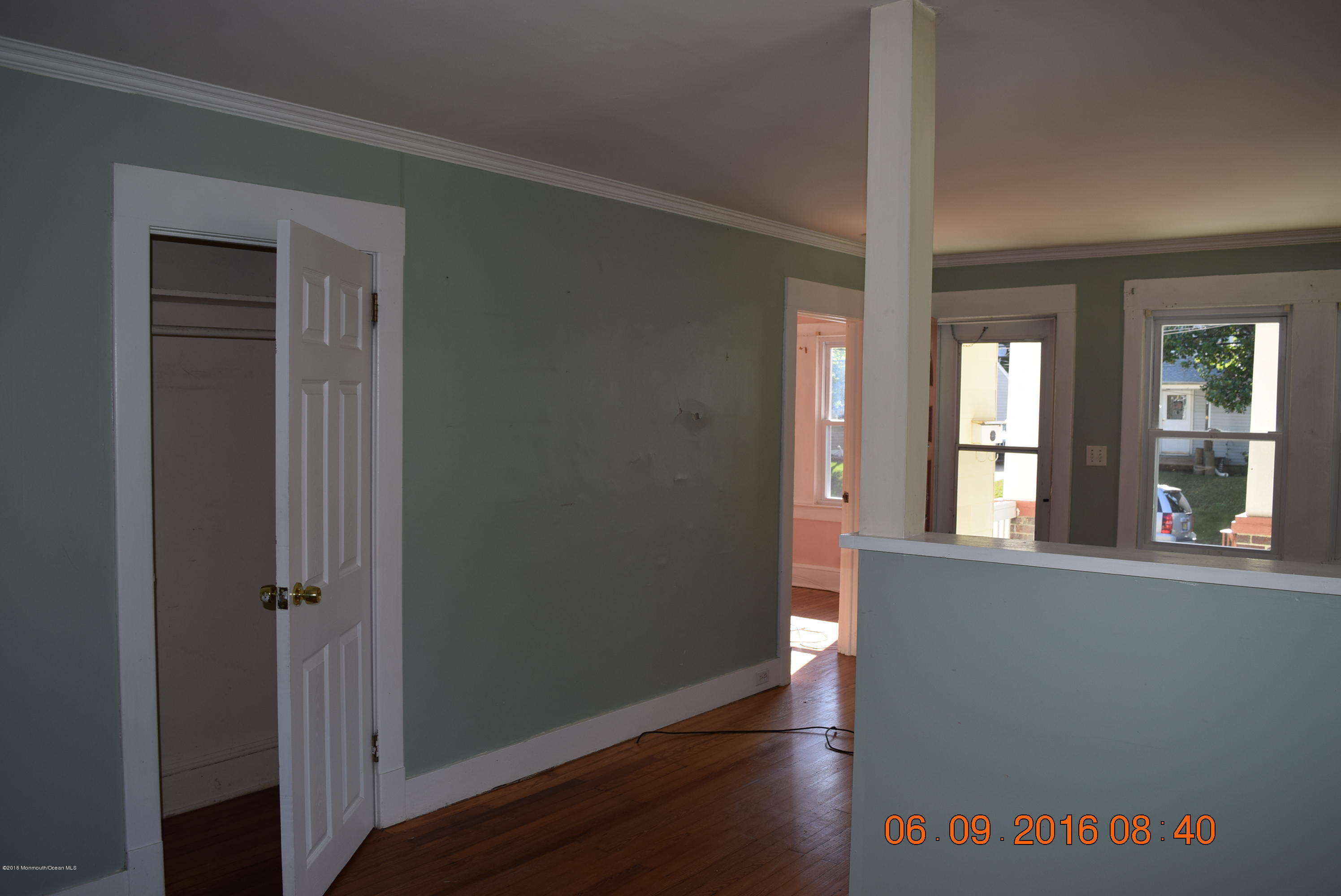 807 Ridge Avenue Neptune City, NJ 07753 - Photo 10 of 15 wooden floor in a hall with a window