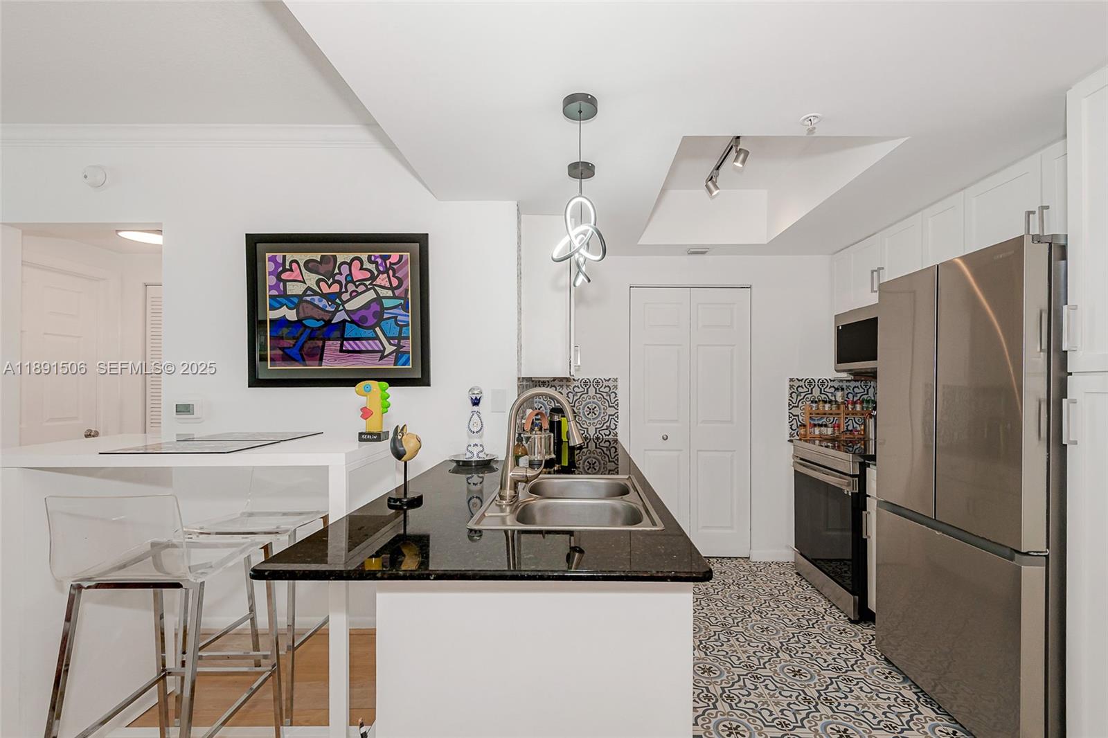 2000 North Bayshore Drive, Unit 907 Miami, FL 33137 - Photo 3 of 51 Modern open kitchen with Mediterranean flair!