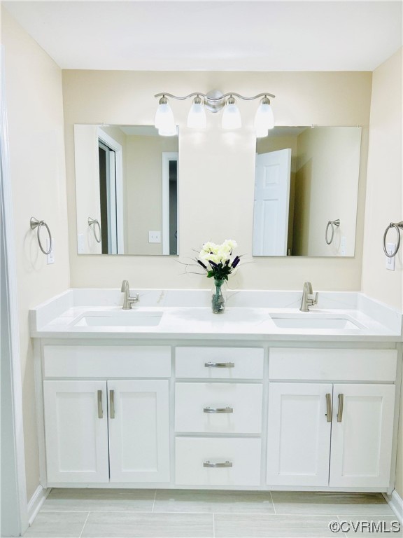 4416 Treely Road Chester, VA 23831 - Photo 19 of 22 a bathroom with a sink vanity and mirror