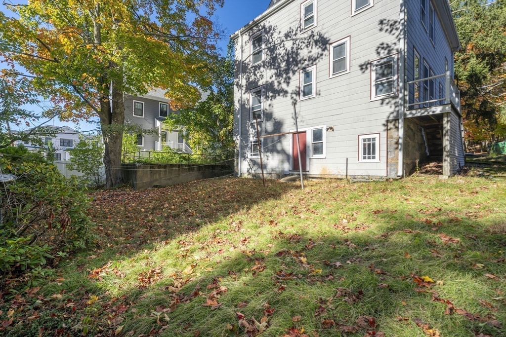 168 Elliot Street, Unit 1 Newton, MA 02464 - Photo 13 of 14 a view of a yard with trees