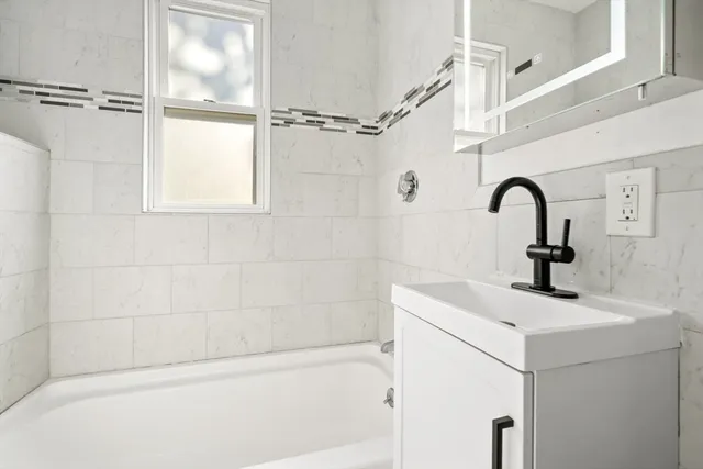 a bathroom with a sink and a shower