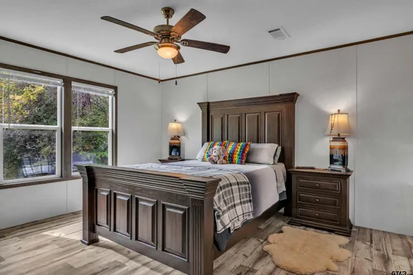 a bed room with a bed and a window