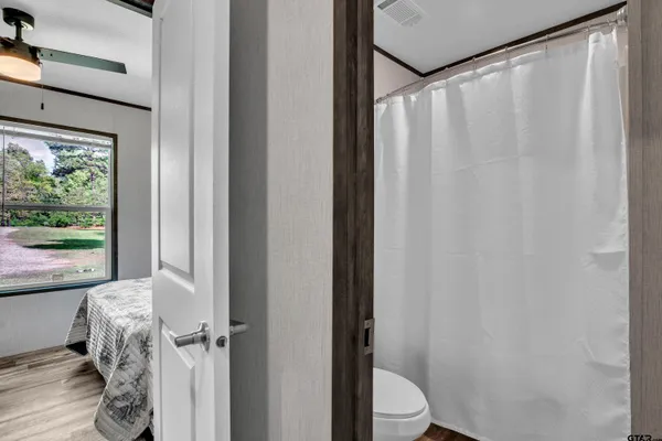 a bathroom with a shower curtain