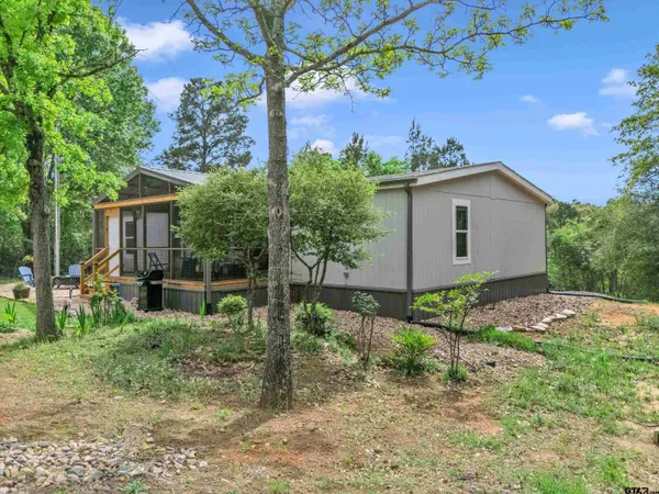 a backyard of a house with lots of green space