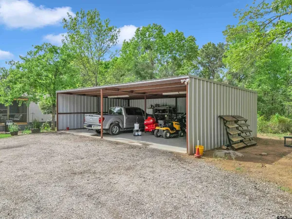 a view of a garage with parked cars