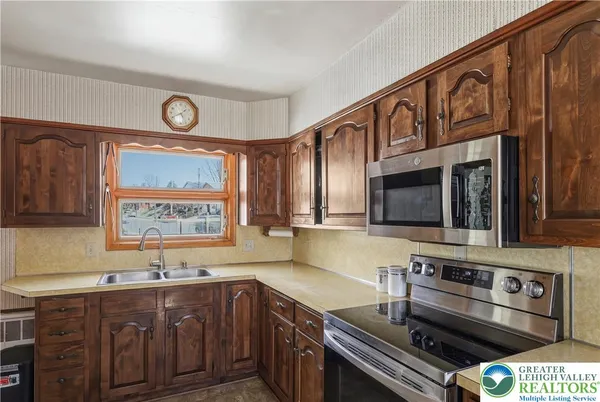 a kitchen with a sink and a window