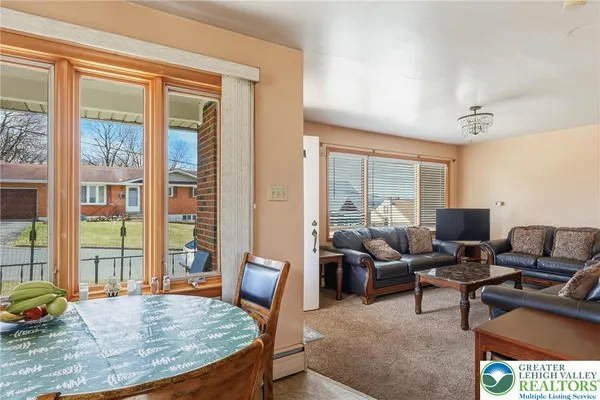 a livingroom with refrigerator and workspace