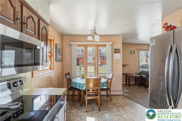a kitchen with stainless steel appliances granite countertop a refrigerator stove and sink