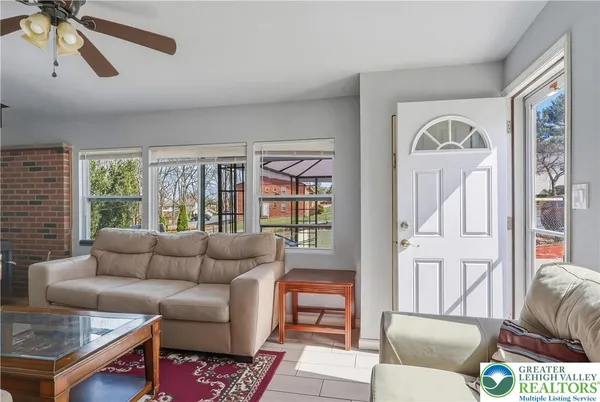 a living room with furniture and a window