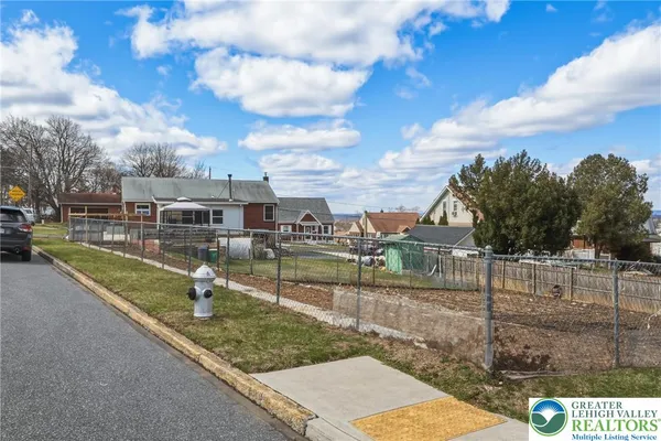 a view of a house with a big yard