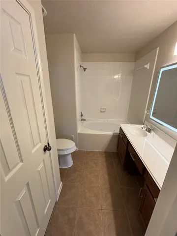 an empty room with a ceiling fan and window