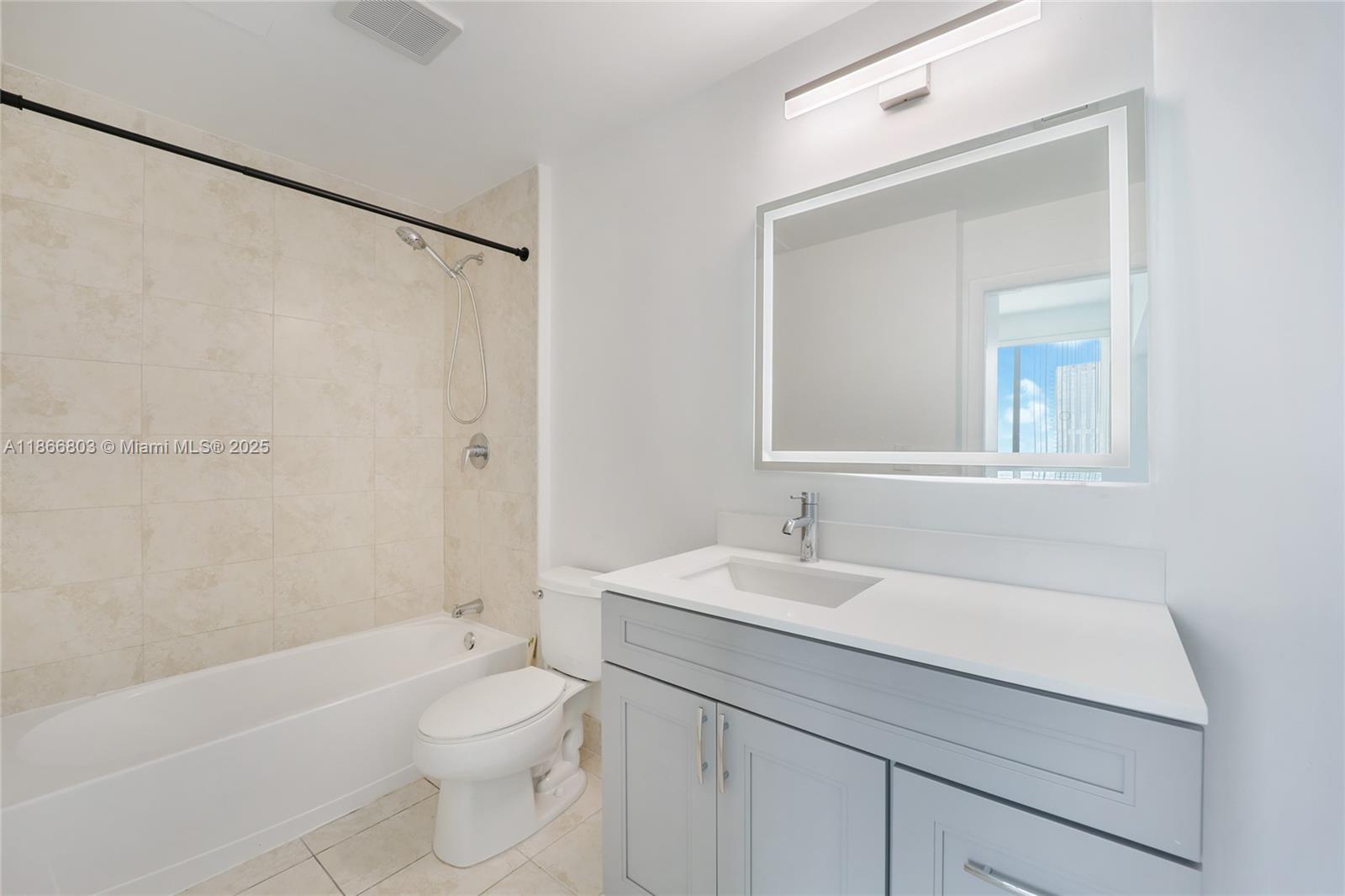 1900 North Bayshore Drive, Unit 4112 Miami, FL 33132 - Photo 12 of 20 a bathroom with a sink a toilet and shower