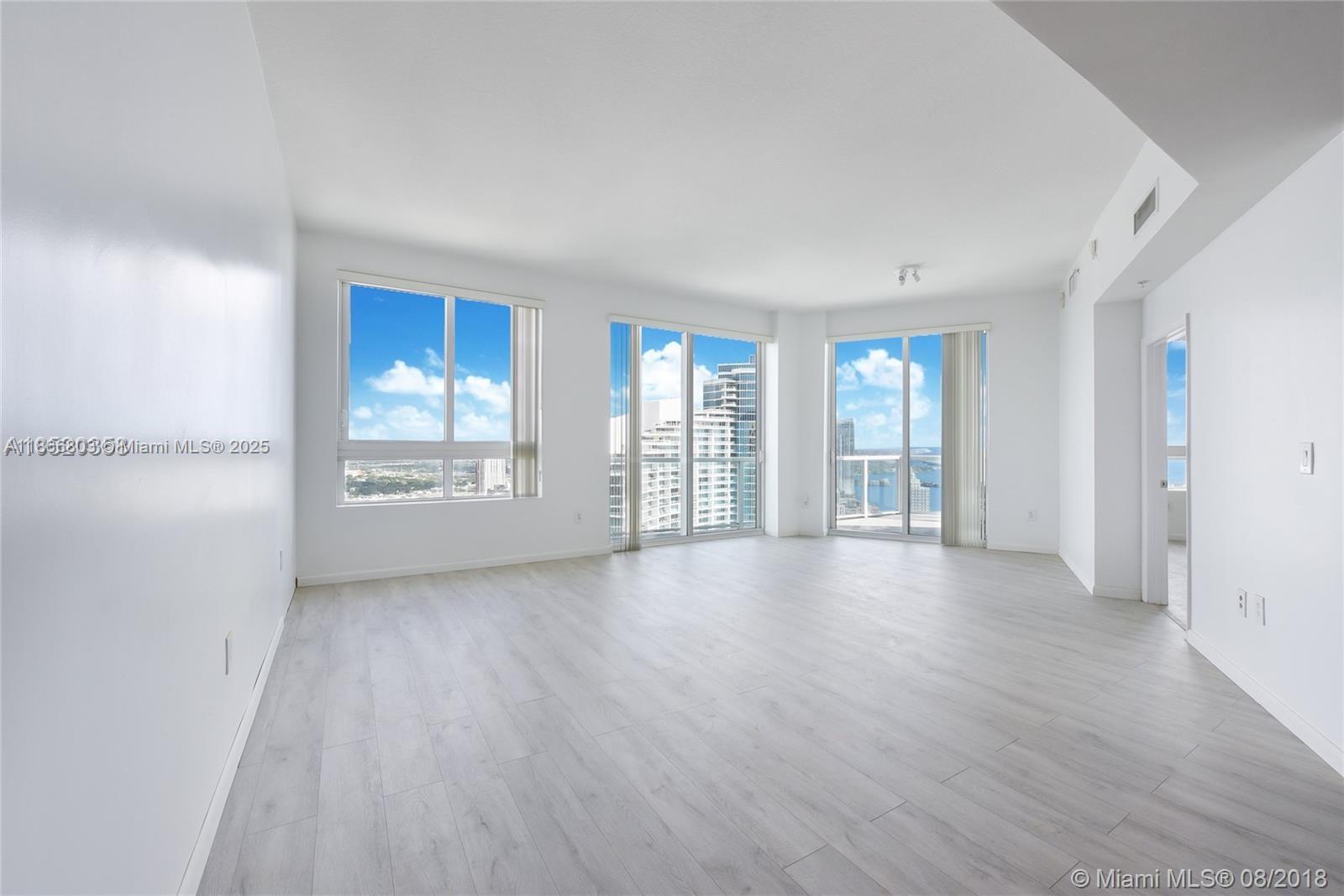 1900 North Bayshore Drive, Unit 4112 Miami, FL 33132 - Photo 9 of 20 wooden floor in an empty room with a window