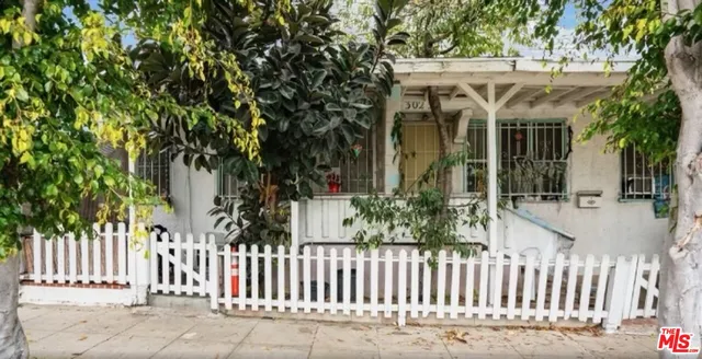 a view of a house with a small yard