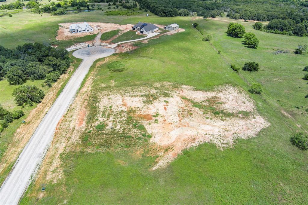 316 Kilkenny Road Poolville, TX 76487 - Photo 5 of 20 a view of a lake with a yard