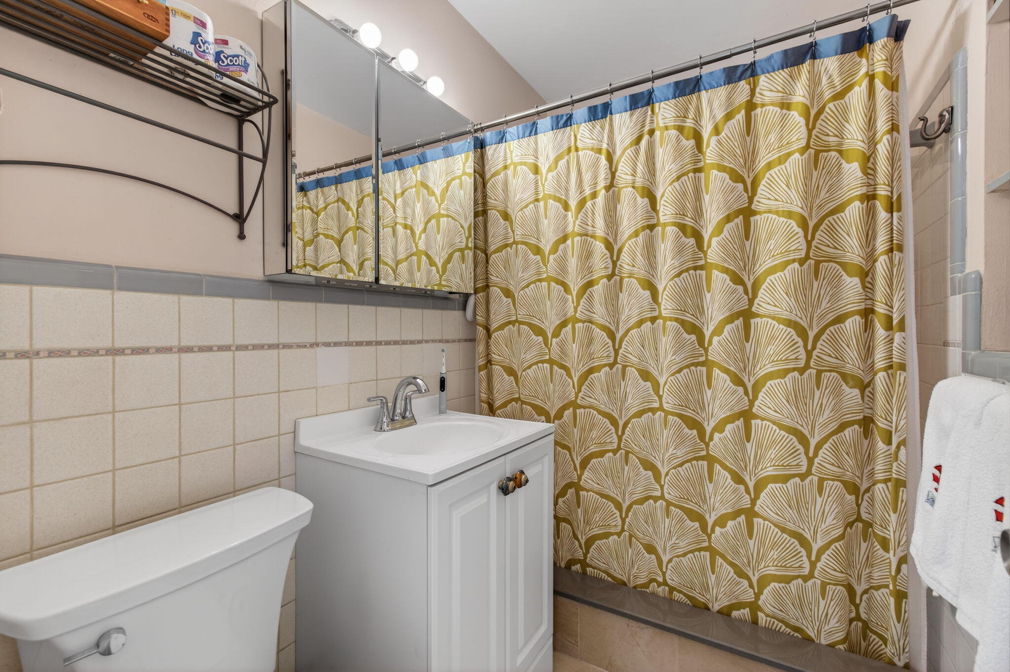 1060 Old Boynton Road Boynton Beach, FL 33426 - Photo 22 of 47 a bathroom with a sink a toilet and shower curtain