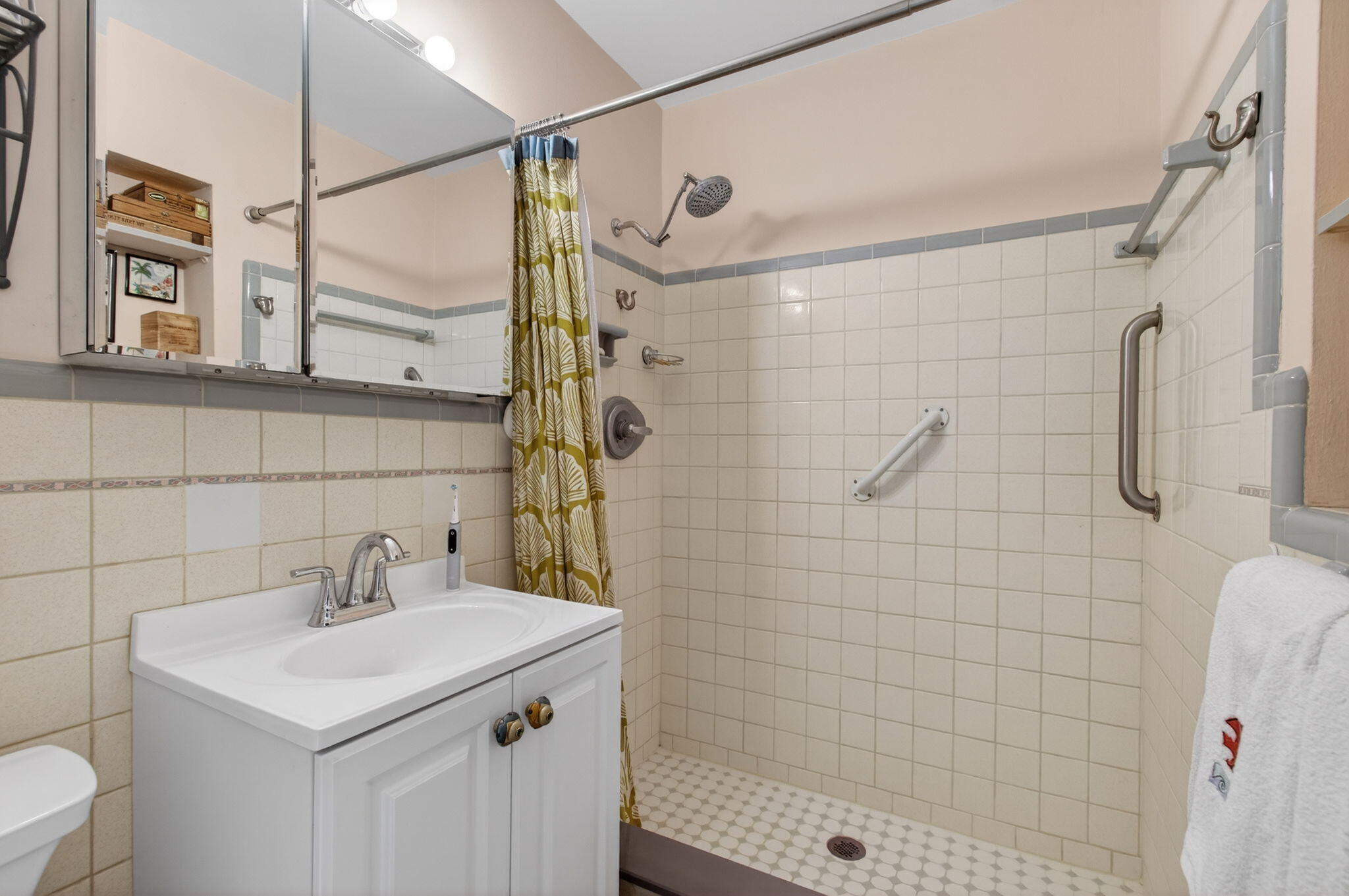 1060 Old Boynton Road Boynton Beach, FL 33426 - Photo 23 of 47 a bathroom with a sink shower and a mirror