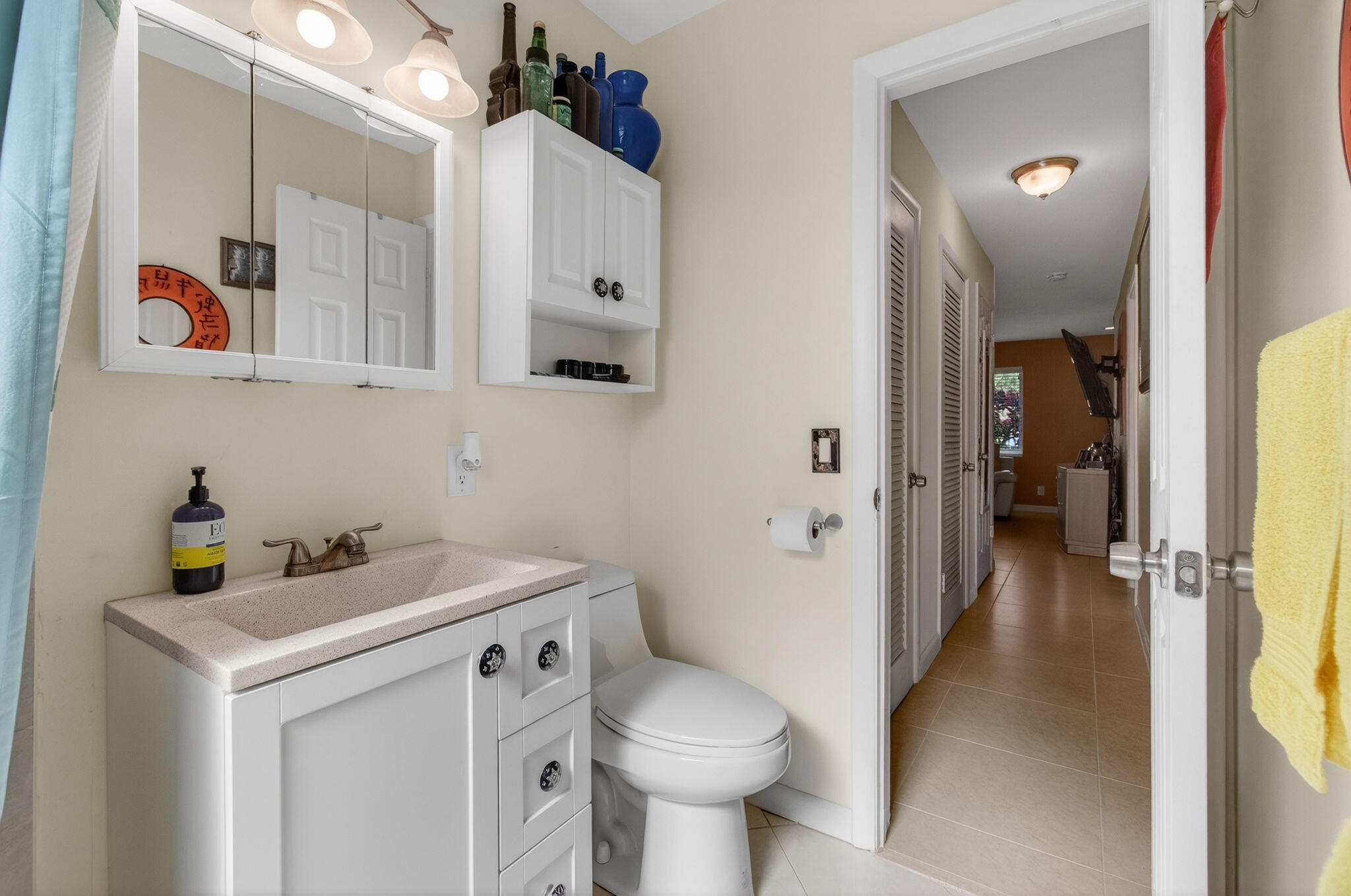 1060 Old Boynton Road Boynton Beach, FL 33426 - Photo 30 of 47 a bathroom with a sink toilet and a mirror