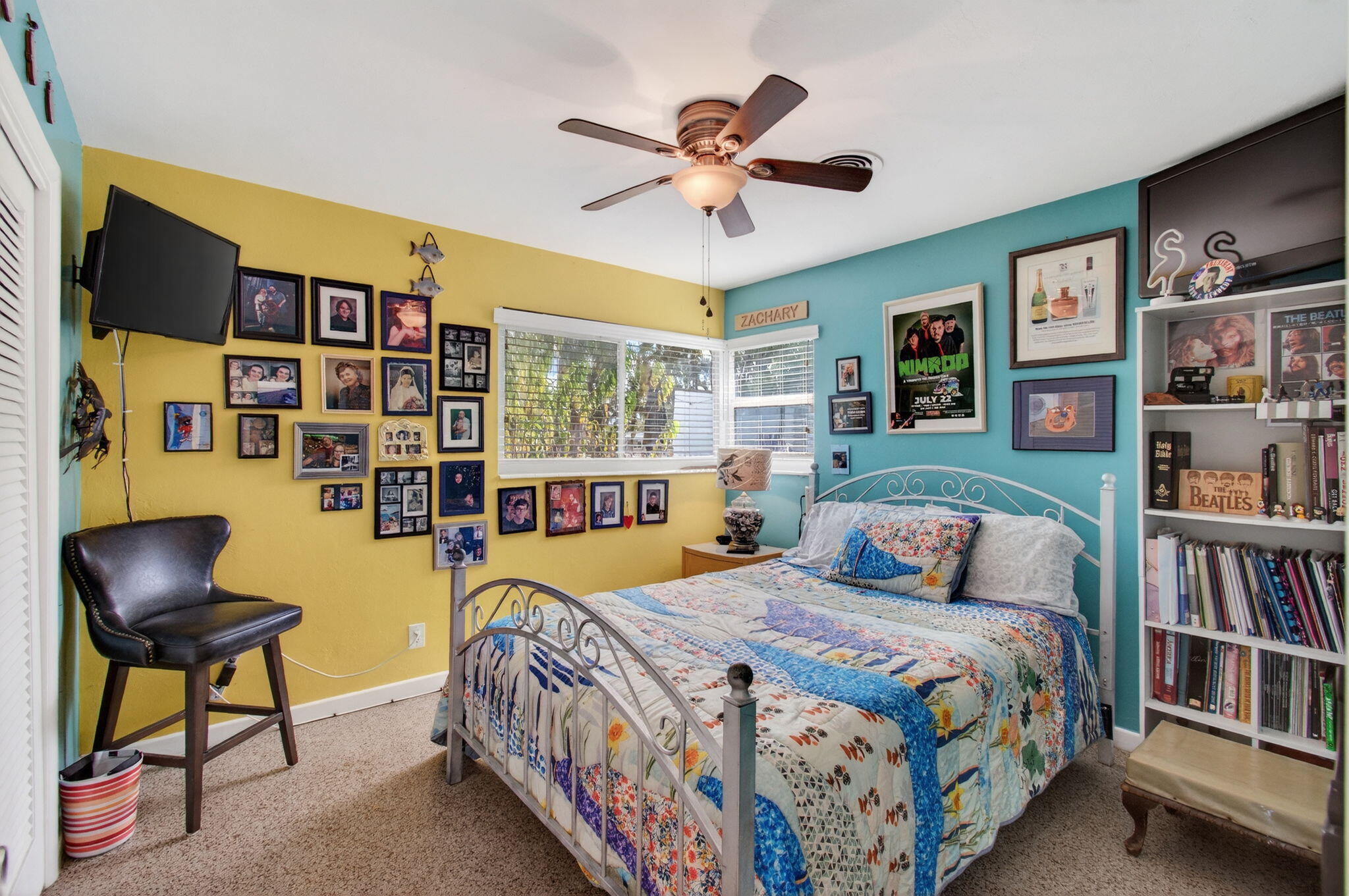 1060 Old Boynton Road Boynton Beach, FL 33426 - Photo 31 of 47 a bedroom with a bed bookshelf and a painting on the wall